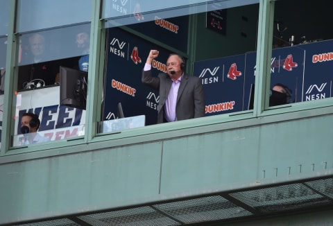 Jun 25, 2021; Boston, Massachusetts, USA; Boston Red Sox broadcaster Jerry Remy signals to former second baseman Dustin Pedoria during pregame ceremonies in Pedoria’s honor prior to a game against the New York Yankees at Fenway Park. Mandatory Credit: Bob DeChiara-USA TODAY Sports