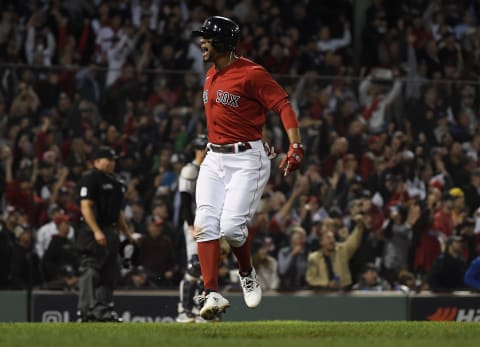 Oct 5, 2021; Boston, Massachusetts, USA; Boston Red Sox shortstop Xander Bogaerts (2) reacts after hitting a two run home run against the New York Yankees during the first inning of the American League Wildcard game at Fenway Park. Mandatory Credit: Bob DeChiara-USA TODAY Sports