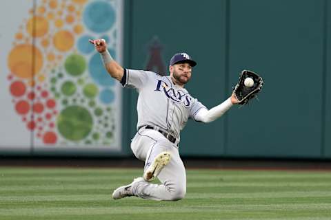 May 9, 2022; Anaheim, California, USA; Tampa Bay Rays center fielder Kevin Kiermaier (39) catches a fly ball by Los Angeles Angels first baseman Jared Walsh (20) in the second inning at Angel Stadium. Mandatory Credit: Kirby Lee-USA TODAY Sports