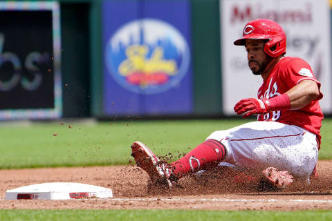 Cincinnati Reds left fielder Tommy Pham (28) slides into third base safely his a triple during the third inning of a baseball game against the Tampa Bay Rays, Sunday, July 10, 2022, at Great American Ball Park in Cincinnati.Tampa Bay Rays At Cincinnati Reds July 10 0039