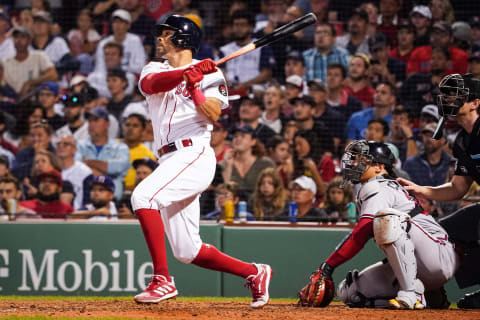 Aug 10, 2022; Boston, Massachusetts, USA; Boston Red Sox left fielder Tommy Pham (22) hits a three run home run against the Atlanta Braves in the seventh inning at Fenway Park. Mandatory Credit: David Butler II-USA TODAY Sports