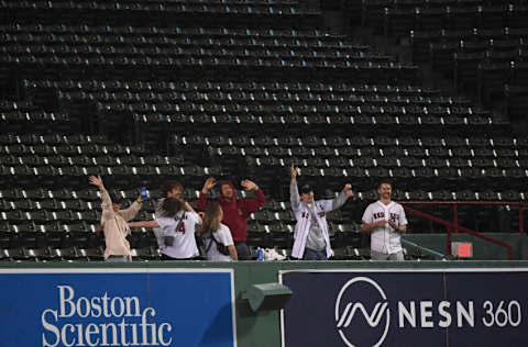 Sep 26, 2022; Boston, Massachusetts, USA; Fans dance in the stands during a rain delay in the game between the Boston Red Sox and Baltimore Orioles at Fenway Park. Mandatory Credit: Bob DeChiara-USA TODAY Sports