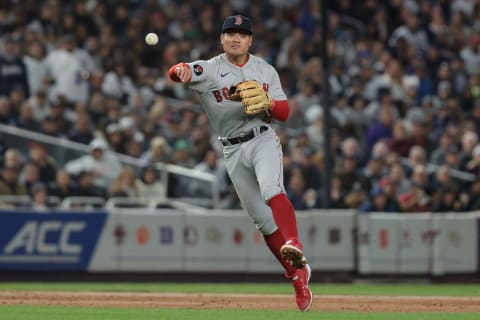 Sep 23, 2022; Bronx, New York, USA; Boston Red Sox shortstop Yu Chang (12) throws the ball to first base for an out during the fifth inning against the New York Yankees at Yankee Stadium. Mandatory Credit: Vincent Carchietta-USA TODAY Sports