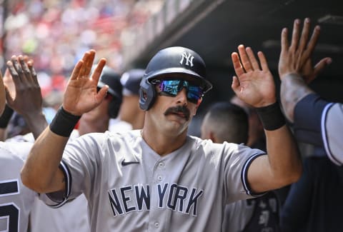 Aug 7, 2022; St. Louis, Missouri, USA; New York Yankees designated hitter Matt Carpenter (24) is congratulated by teammates after hitting a one run sacrifice fly against the St. Louis Cardinals during the first inning at Busch Stadium. Mandatory Credit: Jeff Curry-USA TODAY Sports