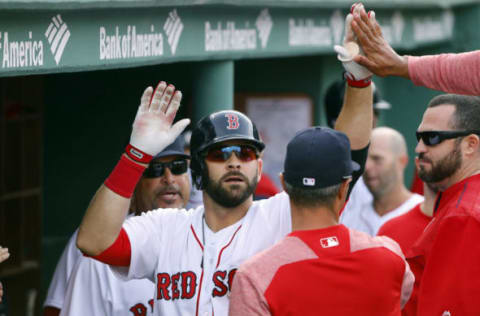 Apr 15, 2017; Boston, MA, USA; Boston Red Sox first baseman Mitch Moreland is congratulated by teammates in the dugout after hitting a solo home run against the Tampa Bay Rays during the second inning at Fenway Park. Mandatory Credit: Winslow Townson-USA TODAY Sports