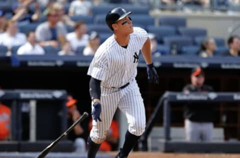 Apr 29, 2017; Bronx, NY, USA; New York Yankees right fielder Aaron Judge (99) watches the ball go into the stands after hitting a home run against the Baltimore Orioles inning at Yankee Stadium. Mandatory Credit: Noah K. Murray-USA TODAY Sports