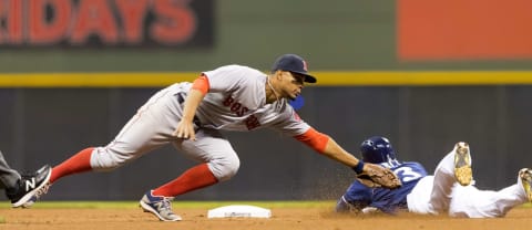 May 9, 2017; Milwaukee, WI, USA; Boston Red Sox shortstop Xander Bogaerts (2) tags out Milwaukee Brewers shortstop Orlando Arcia (3) during the fourth inning at Miller Park. Mandatory Credit: Jeff Hanisch-USA TODAY Sports