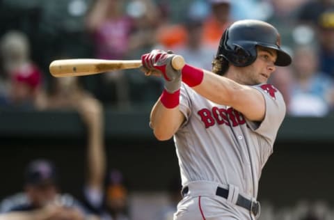 Jun 4, 2017; Baltimore, MD, USA; Boston Red Sox left fielder Andrew Benintendi (16) hits a RBI single in the ninth inning during a game against the Baltimore Orioles at Oriole Park at Camden Yards. Mandatory Credit: Patrick McDermott-USA TODAY Sports