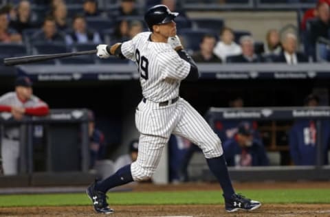 Jun 6, 2017; Bronx, NY, USA; New York Yankees right fielder Aaron Judge (99) hits a double against the Boston Red Sox during the fifth inning at Yankee Stadium. Mandatory Credit: Adam Hunger-USA TODAY Sports