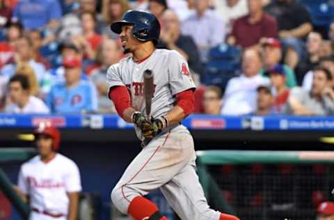 Jun 14, 2017; Philadelphia, PA, USA; Boston Red Sox right fielder Mookie Betts (50) watches his solo home run during the fourth inning against the Philadelphia Phillies at Citizens Bank Park. The Red Sox defeated the Phillies, 7-3. Mandatory Credit: Eric Hartline-USA TODAY Sports