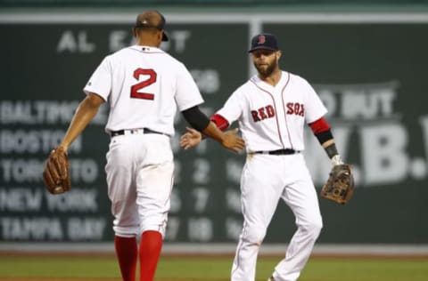 Jul 19, 2016; Boston, MA, USA; Boston Red Sox shortstop Xander Bogaerts (2) and second baseman Dustin Pedroia (15) congratulate each other after completing a double play against the San Francisco Giants during the third inning at Fenway Park. Mandatory Credit: Winslow Townson-USA TODAY Sports