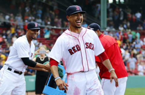 Aug 14, 2016; Boston, MA, USA; Boston Red Sox right fielder Mookie Betts (50) smiles after he was doused with Powerade by shortstop Xander Bogaerts (2) after the Boston Red Sox 16-2 win over the Arizona Diamondbacks at Fenway Park. Betts had three home runs in the win. Mandatory Credit: Winslow Townson-USA TODAY Sports