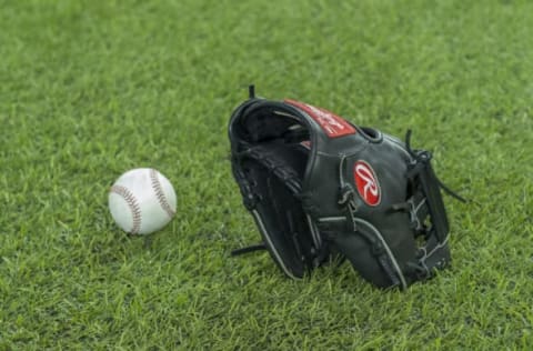 Sep 10, 2016; Toronto, Ontario, CAN; A Toronto Blue Jays glove and ball sit on the field during batting practice before a game against the Boston Red Sox at Rogers Centre. Mandatory Credit: Nick Turchiaro-USA TODAY Sports