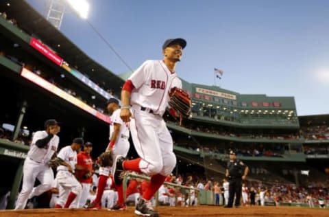 Sep 13, 2016; Boston, MA, USA; Boston Red Sox right fielder Mookie Betts (50) and his teammates take the field before their game against the Baltimore Orioles at Fenway Park. Mandatory Credit: Winslow Townson-USA TODAY Sports