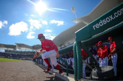 Feb 24, 2017; Fort Myers, FL, USA; Boston Red Sox left fielder Andrew Benintendi (16) runs out of the dugout to start the game against the New York Mets at JetBlue Park. Mandatory Credit: Kim Klement-USA TODAY Sports