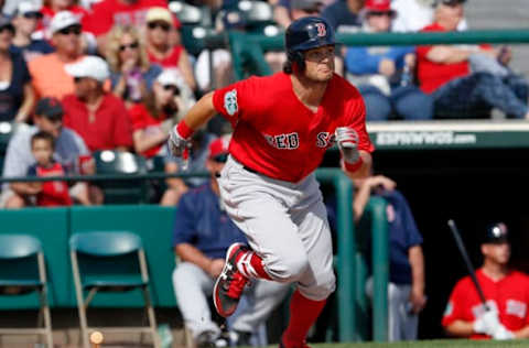 Mar 3, 2017; Lake Buena Vista, FL, USA; Boston Red Sox left fielder Andrew Benintendi (16) runs to first as he watches his ball leave the park for a solo home run during the sixth inning of an MLB spring training baseball game against the Atlanta Braves at Champion Stadium. Mandatory Credit: Reinhold Matay-USA TODAY Sports