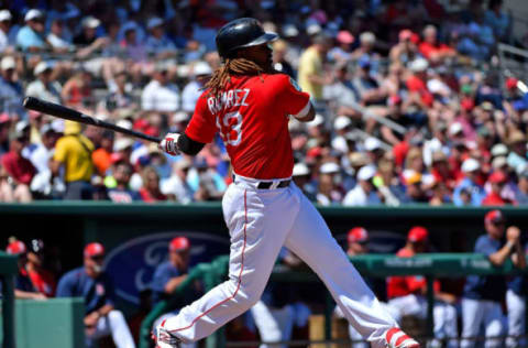 Mar 20, 2017; Fort Myers, FL, USA; Boston Red Sox first baseman Hanley Ramirez (13) singles in a run against the Baltimore Orioles during a spring training game at JetBlue Park. Mandatory Credit: Jasen Vinlove-USA TODAY Sports