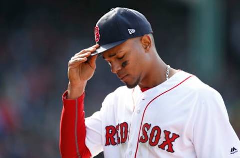 Apr 3, 2017; Boston, MA, USA; Boston Red Sox shortstop Xander Bogaerts (2) take his cap off during the seventh inning against the Pittsburgh Pirates at Fenway Park. Mandatory Credit: Greg M. Cooper-USA TODAY Sports