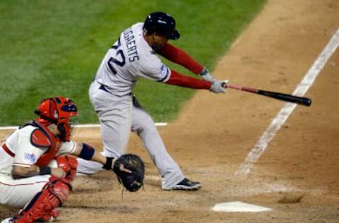 Oct 26, 2013; St. Louis, MO, USA; Boston Red Sox shortstop Xander Bogaerts hits a RBI single against the St. Louis Cardinals in the 8th inning during game three of the MLB baseball World Series at Busch Stadium. Mandatory Credit: H. Darr Beiser-USA TODAY Sports