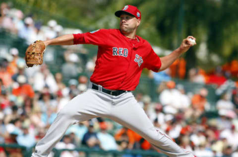 Mar 8, 2016; Sarasota, FL, USA; Boston Red Sox starting pitcher Brian Johnson (61) throws a pitch during the third inning against the Baltimore Orioles at Ed Smith Stadium. Mandatory Credit: Kim Klement-USA TODAY Sports