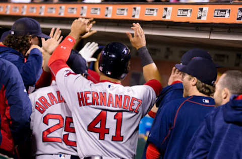 Jun 7, 2016; San Francisco, CA, USA; Boston Red Sox second baseman Marco Hernandez (41) celebrates with teammates in the dugout after scoring against the San Francisco Giants in the tenth inning at AT&T Park. Mandatory Credit: John Hefti-USA TODAY Sports