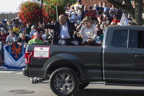 Jul 23, 2016; Cooperstown, NY, USA; Hall of Famer Orlando Cepeda and his wife during the MLB baseball hall of fame parade of legends at National Baseball Hall of Fame. Mandatory Credit: Gregory J. Fisher-USA TODAY Sports