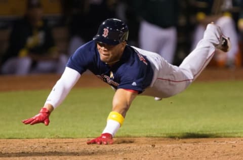 Sep 2, 2016; Oakland, CA, USA; Boston Red Sox third baseman Yoan Moncada (65) dives for a run against the Oakland Athletics during the eighth inning at Oakland Coliseum. Mandatory Credit: Kelley L Cox-USA TODAY Sports