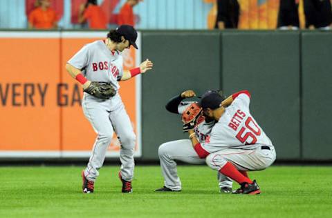 Sep 21, 2016; Baltimore, MD, USA; Boston Red Sox outfielders Andrew Benintendi (left), Jackie Bradley, Jr. (center) and Mookie Betts (right) celebrate after beating the Baltimore Orioles 5-1 at Oriole Park at Camden Yards. Mandatory Credit: Evan Habeeb-USA TODAY Sports