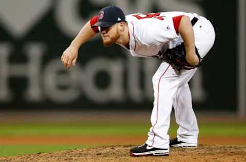 Oct 10, 2016; Boston, MA, USA; Boston Red Sox relief pitcher Craig Kimbrel (46) prepares to deliver a pitch in the eighth inning against the Cleveland Indians during game three of the 2016 ALDS playoff baseball series at Fenway Park. Mandatory Credit: Greg M. Cooper-USA TODAY Sports