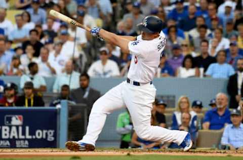 Oct 20, 2016; Los Angeles, CA, USA; Los Angeles Dodgers shortstop Corey Seager (5) connects for a base hit in the first inning against the Los Angeles Dodgers in game five of the 2016 NLCS playoff baseball series against the Los Angeles Dodgers at Dodger Stadium. Mandatory Credit: Richard Mackson-USA TODAY Sports