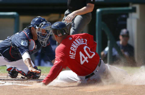 Mar 3, 2017; Lake Buena Vista, FL, USA; Boston Red Sox Marco Hernandez (40) is tagged out trying to get home by Atlanta Braves catcher Kurt Suzuki (24) during the third inning of an MLB spring training baseball game at Champion Stadium. Mandatory Credit: Reinhold Matay-USA TODAY Sports