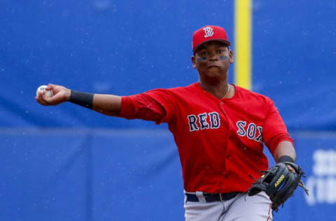 Mar 13, 2017; Dunedin, FL, USA; Boston Red Sox third baseman Rafael Devers (74) throws to first for the out on Toronto Blue Jays batter Ryan Goins (17) in the fourth inning of a baseball game during spring training at Florida Auto Exchange Stadium. Mandatory Credit: Butch Dill-USA TODAY Sports