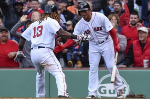 Apr 13, 2017; Boston, MA, USA; Boston Red Sox first baseman Hanley Ramirez (13) celebrates with Boston Red Sox third baseman Marco Hernandez after scoring the go ahead run during the eighth inning against the Pittsburgh Pirates at Fenway Park. Mandatory Credit: Bob DeChiara-USA TODAY Sports