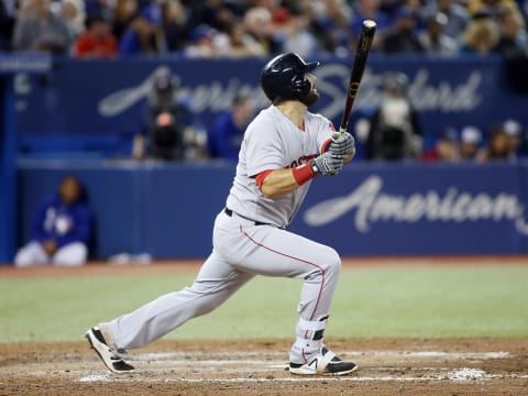 Apr 18, 2017; Toronto, Ontario, CAN; Boston Red Sox first baseman Mitch Moreland (18) hits an RBI double in the fifth inning against the Toronto Blue Jays at the Rogers Centre. Mandatory Credit: John E. Sokolowski-USA TODAY Sports