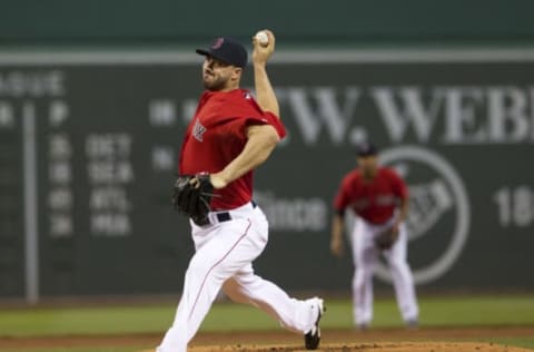 May 30, 2014; Boston, MA, USA; Boston Red Sox starting pitcher Brandon Workman (67) throws a pitch against the Tampa Bay Rays during the first inning at Fenway Park. Mandatory Credit: David Butler II-USA TODAY Sports