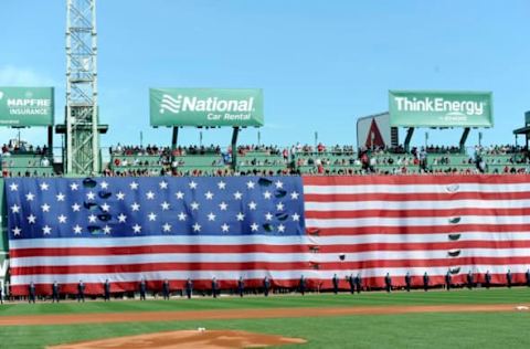 Apr 17, 2017; Boston, MA, USA; The US flag is draped over the center field wall during the national anthem prior to a game between the Boston Red Sox and the Tampa Bay Rays at Fenway Park. Mandatory Credit: Bob DeChiara-USA TODAY Sports