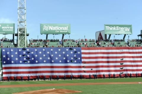 Apr 17, 2017; Boston, MA, USA; The US flag is draped over the center field wall during the national anthem prior to a game between the Boston Red Sox and the Tampa Bay Rays at Fenway Park. Mandatory Credit: Bob DeChiara-USA TODAY Sports