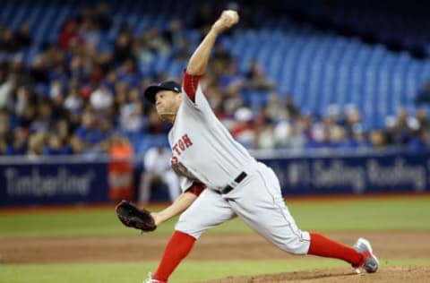 Apr 18, 2017; Toronto, Ontario, CAN; Boston Red Sox starting pitcher Brian Johnson (61) pitches to the Toronto Blue Jays during the second inning at the Rogers Centre. Mandatory Credit: John E. Sokolowski-USA TODAY Sports