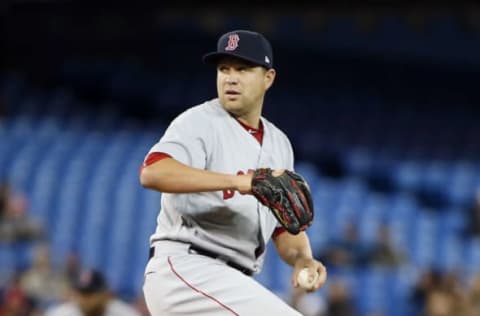 Apr 18, 2017; Toronto, Ontario, CAN; Boston Red Sox starting pitcher Brian Johnson (61) pitches to the Toronto Blue Jays during the second inning at the Rogers Centre. Mandatory Credit: John E. Sokolowski-USA TODAY Sports