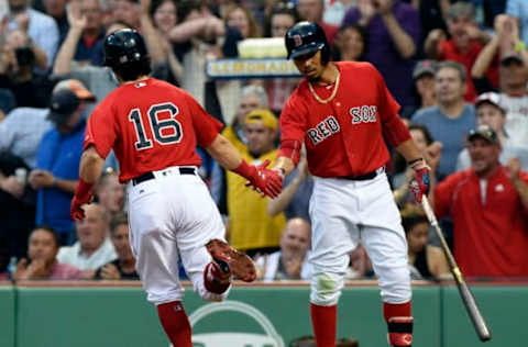 Apr 28, 2017; Boston, MA, USA; Boston Red Sox left fielder Andrew Benintendi (16) is congratulated by right fielder Mookie Betts (50) after hitting a home run during the first inning against the Chicago Cubs at Fenway Park. Mandatory Credit: Bob DeChiara-USA TODAY Sports