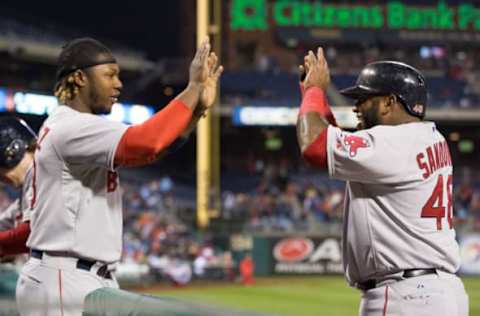 Apr 9, 2015; Philadelphia, PA, USA; Boston Red Sox third baseman Pablo Sandoval (48) high fives left fielder Hanley Ramirez (13) after scoring against the Philadelphia Phillies during the third inning at Citizens Bank Park. Mandatory Credit: Bill Streicher-USA TODAY Sports