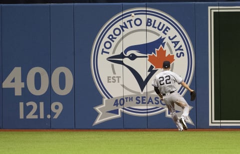 Apr 12, 2016; Toronto, Ontario, CAN; New York Yankees center fielder Jacoby Ellsbury (22) tries to field a ball during the third inning in a game against the Toronto Blue Jays at Rogers Centre. Mandatory Credit: Nick Turchiaro-USA TODAY Sports