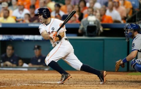 Oct 12, 2015; Houston, TX, USA; Houston Astros second baseman Jose Altuve #27 bats against the Kansas City Royals in game four of the ALDS at Minute Maid Park. Mandatory Credit: Thomas B. Shea-USA TODAY Sports