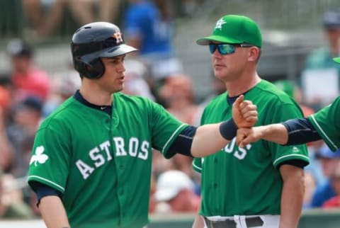 Mar 17, 2016; Kissimmee, FL, USA; Houston Astros left fielder Preston Tucker (20) is congratulated manager A.J. Hinch (14) and teammates as he hit s 2-run home run during the fifth inning against the Toronto Blue Jays at Osceola County Stadium. Mandatory Credit: Kim Klement-USA TODAY Sports