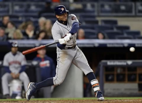 Apr 6, 2016; Bronx, NY, USA; Houston Astros shortstop Carlos Correa (1) hits a single against the New York Yankees during the seventh inning at Yankee Stadium. Mandatory Credit: Adam Hunger-USA TODAY Sports