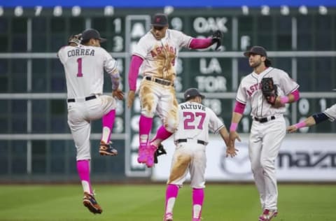 May 8, 2016; Houston, TX, USA; Houston Astros shortstop Carlos Correa (1), right fielder George Springer (4), second baseman Jose Altuve (27), and center fielder Jake Marisnick (6) celebrate after defeating the Seattle Mariners 5-1 at Minute Maid Park. Mandatory Credit: Troy Taormina-USA TODAY Sports