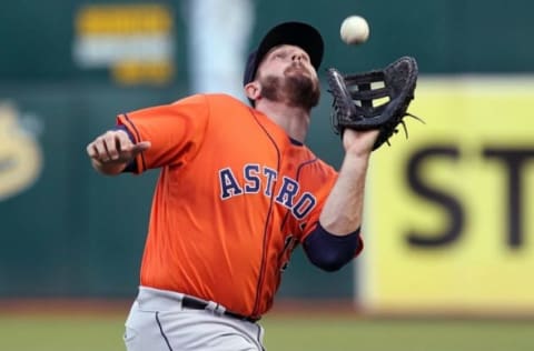 Apr 29, 2016; Oakland, CA, USA; Houston Astros first baseman Tyler White (13) catches Oakland Athletics DH Khris Davis (2) (not pictured) fly ball in the second inning of their MLB baseball game at O.co Coliseum. Mandatory Credit: Lance Iversen-USA TODAY Sports