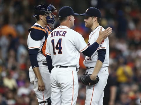 Jun 4, 2016; Houston, TX, USA; Houston Astros manager A.J. Hinch (14) takes the ball from starting pitcher Collin McHugh (31) during a pitching change in the sixth inning against the Oakland Athletics at Minute Maid Park. Mandatory Credit: Troy Taormina-USA TODAY Sports