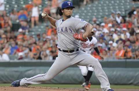 Aug 2, 2016; Baltimore, MD, USA; Texas Rangers starting pitcher Yu Darvish (11) pitches during the first inning against the Baltimore Orioles at Oriole Park at Camden Yards. Mandatory Credit: Tommy Gilligan-USA TODAY Sports