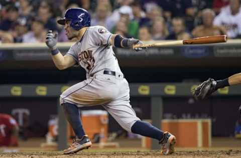 Aug 9, 2016; Minneapolis, MN, USA; Houston Astros second baseman Jose Altuve (27) hits a single in the sixth inning against the Minnesota Twins at Target Field. Mandatory Credit: Jesse Johnson-USA TODAY Sports